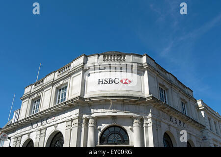 exterior with name and logo of a branch of hsbc bank occupying a 19th century building in kingston upon thames, surrey, england Stock Photo