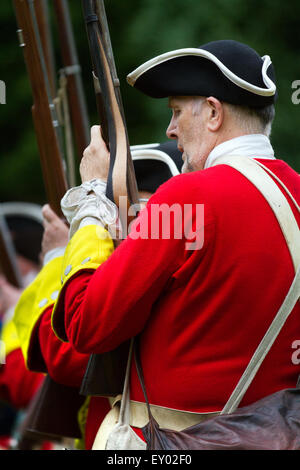 Hoghton, Preston, Lancashire, UK. 18th July, 2015.  The Queen's Royal Regiment Living History Group'   Red coats of the English Army at the Battle of Preston – the last battle on English soil. This year sees the 300th anniversary of the last battle on English soil and a decisive moment in the first Jacobite Rising. The Battle of Preston (9–14 November 1715), also referred to as the Preston Fight, was fought during the Jacobite Rising of 1715 (often referred to as the First Jacobite Rising, or Rebellion by supporters, muskets firing guns gun soldiers soldiers of the Hanoverian government). Stock Photo