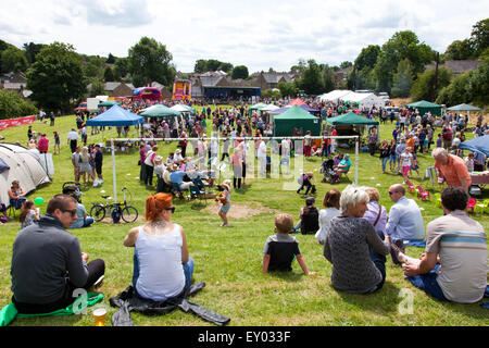 Crich, Derbyshire, UK. 18th July, 2015. Crowds enjoy warm, sunny weather at the Crich Carnival. The annual event is held on the playing fields in the centre of the Derbyshire village creating a typically English summer scene of village fete and carnivals. Credit:  Mark Richardson/Alamy Live News Stock Photo