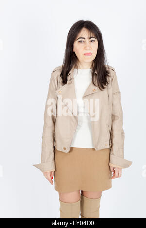 Beautiful woman doing different expressions in different sets of clothes: worried Stock Photo