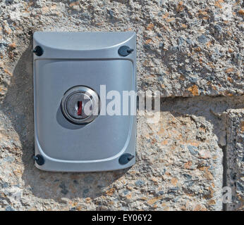 close up of a grey lock on a brick wall Stock Photo