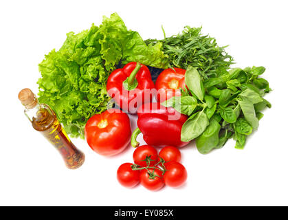 Pile of assorted vegetables and cooking oil isolated on white background Stock Photo