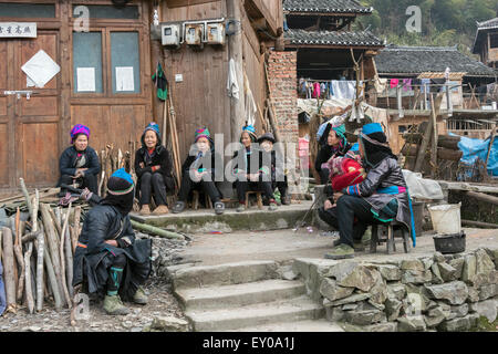 Gathering of older women, Huanggang Dong Village, Guizhou Province, China Stock Photo