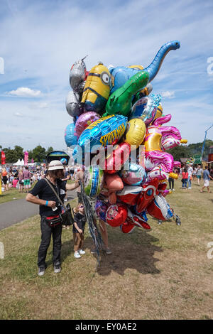 A balloon vendor sells helium balloons in Brockwell Park, London England United Kingdom UK Stock Photo