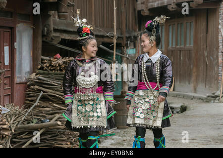 Young Dong women in traditional attire, Huanggang Dong Village, Guizhou Province, China Stock Photo