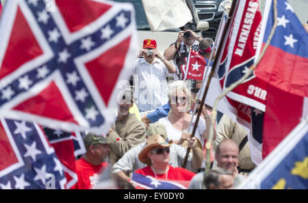 Graham, North Carolina, USA. 18th July, 2015. Rally participants, some wearing confederate symbols and waving confederate flags, gathered at the historic Alamance County courthouse in support of the Confederate monument during the ''Rally For Our Monument''Â in downtown Graham, N.C. on July 18, 2015. The event, which drew as many as 1500 people, was created in response to the controversy surrounding the Confederate battle flag in South Carolina and Concerned Citizens of Alamance County's intent on requesting the removal of the monument. Rally participants, some wearing confederate symbols an Stock Photo