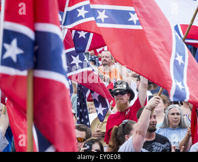 Graham, North Carolina, USA. 18th July, 2015. Rally participants, some wearing confederate symbols and waving confederate flags, gathered at the historic Alamance County courthouse in support of the Confederate monument during the ''Rally For Our Monument''Â in downtown Graham, N.C. on July 18, 2015. The event, which drew as many as 1500 people, was created in response to the controversy surrounding the Confederate battle flag in South Carolina and Concerned Citizens of Alamance County's intent on requesting the removal of the monument. Rally participants, some wearing confederate symbols an Stock Photo