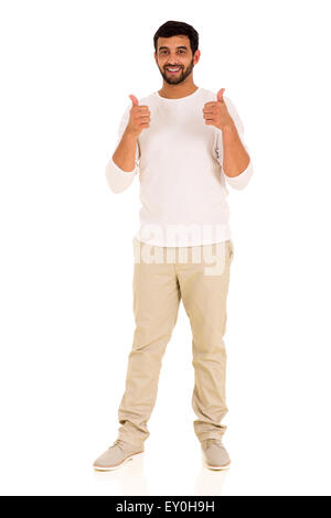 cheerful young Indian man giving thumbs up on white background Stock Photo