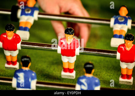 Vintage Foosball, Blue and Red Players Team in Table Soccer or Football Kicker Game, Selective Focus, Retro Tone Effect Stock Photo