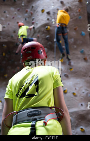 Instructor and climbers at an indoor climbing centre in the UK Stock Photo