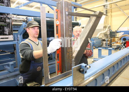 Frankfurt, Germany - February 19, 2009 - Two german workers constructing machines Stock Photo