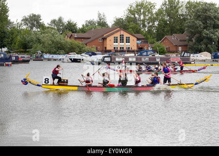 Northampton, UK. 19th July, 2015. The Annual Dragon Boat Race which has always been free to watch, held on the river Nene by Midsummer Meadow close to the town centre is being held for the first time at Billing Aquadrome with a charge to enter the park, to support the Rotary Club who organise the event. Teams of 10 rowers and a drummer will paddle their Dragon Boat and compete against 47 teams to achieve the best time over the course through three preliminary rounds, semi-finals and finals. Team, Raw Hope no 8 winners of the second heat. Credit:  Keith J Smith./Alamy Live News Stock Photo