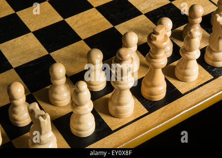 chess pieces arranged for the beginning of a game Stock Photo