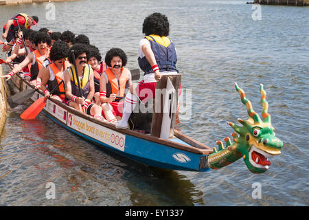 Poole, Dorset, UK. 19 July, 2015. Crowds turn out to support the Poole Dragon Boat Race, Poole Dragon Boat Racing, on the boating lake at Poole Park, hosted by Diverse Abilities Plus & Poole Hospital Charity. Credit:  Carolyn Jenkins/Alamy Live News Stock Photo