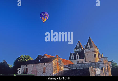 Hot air balloon glides over the Chateau Les Milandes. Dordogne France. Former home of Josephine Baker. Stock Photo