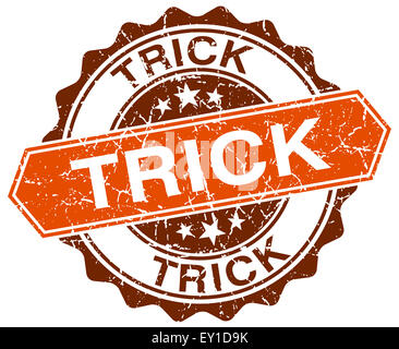 trick orange round grunge stamp on white Stock Photo