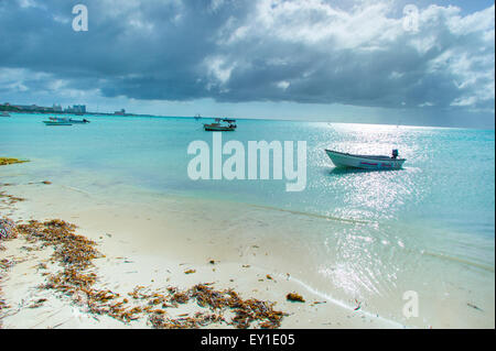 Fishing Boats on the shore of Aruba Stock Photo