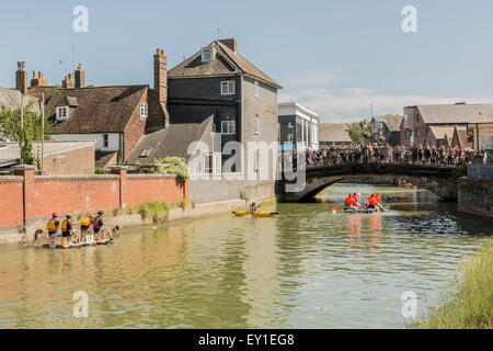 East Sussex, UK. 19th July, 2015. The 40th Lewes to Newhaven Raft Race on Sunday 19 July 2015 - here  rafts approach the Cliffe High Street bridge on the River Ouse flowing through Lewes, East Sussex. Credit:  Malcolm McHugh/Alamy Live News Stock Photo