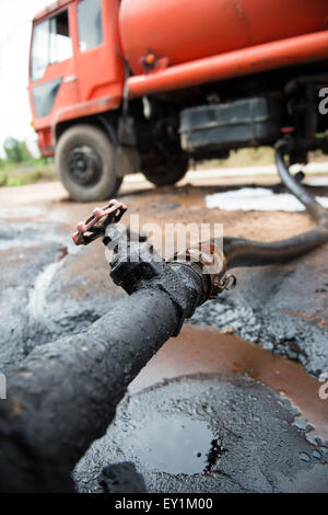 red truck transfer crude oil from the tank Stock Photo