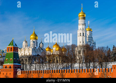 Moscow Kremlin wall and cathedrals in winter against the background of blue sky Stock Photo