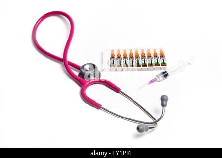 ampule syringe and stethoscope on white table Stock Photo