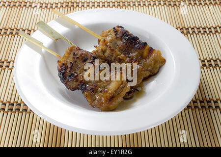 Sticky Pork bbq traditional thai food on white dish Stock Photo