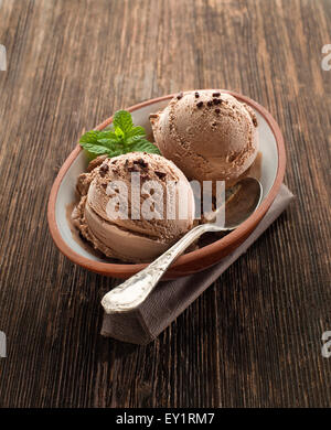 Chocolate ice cream on a wooden background close up Stock Photo