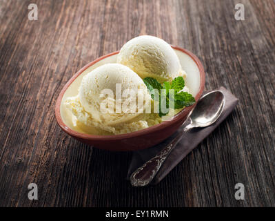 Vanilla Ice cream on a wooden background close up Stock Photo