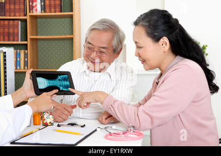 Senior couple seeing the doctor and smiling, Stock Photo
