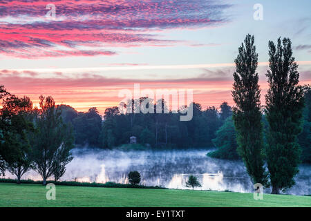 Sunrise over the Doric Temple and lake in the grounds of the Bowood Estate in Wiltshire. Stock Photo