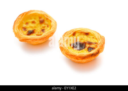 two single portuguese egg tarts on a white background Stock Photo