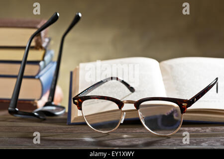 still life with eyeglasses and books on the table Stock Photo