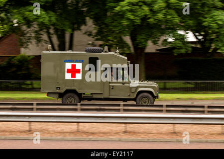 British Army Battlefield Ambulance Land Rover travelling along the Kingsway West Dual Carriageway in Dundee, UK Stock Photo
