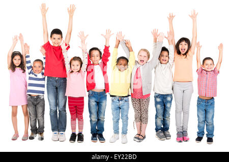 Group of children posing with raised hands isolated in white Stock Photo