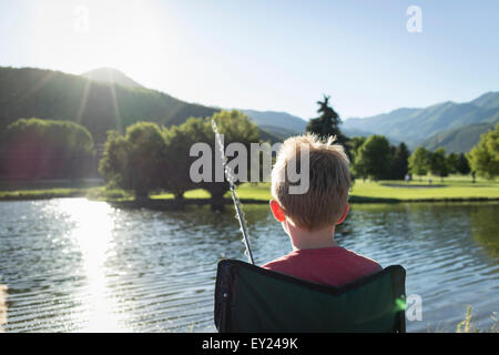 Young boy fishing, rear view, Washington State Park, Utah, USA Stock Photo