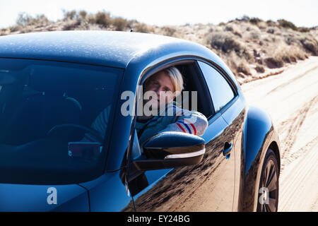 Man driving on road trip, Tuba City, Arizona, USA Stock Photo