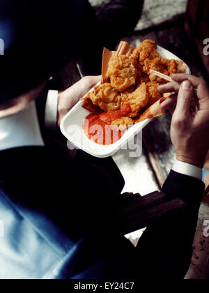 1920s style dinner scene - man eating fried clams Stock Photo