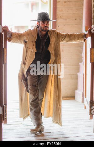Cowboy standing in saloon doorway on wild west film set, Fort Bravo, Tabernas, Almeria, Spain Stock Photo