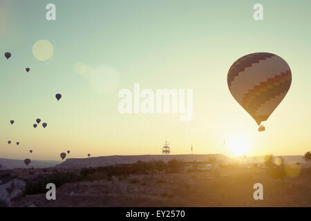 Silhouetted hot air balloons above Cappadocia, Anatolia, Turkey Stock Photo