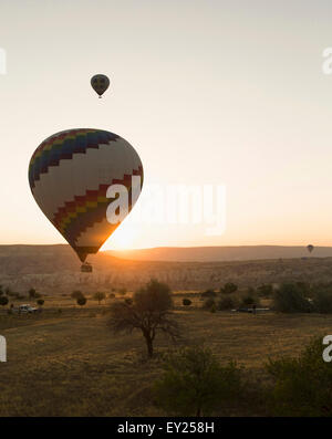 Two silhouetted hot air balloons at sunset, Cappadocia, Anatolia, Turkey Stock Photo