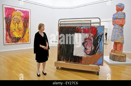 Chemnitz, Germany. 20th July, 2015. Curator Ingrind Moessinger stands next to the Baselitz works 'Blick aus dem Fenster' (lit. View from the window), which has been placed on a cart and the sculpture 'Mondrains Schwester' (lit. Mondrians sister) at the Art Collections Chmenitz in Chemnitz, Germany, 20 July 2015. Two loans of Georg Baselitz were removed from the exhibition. The Saxony based artist reclaimed his loans from German museums in connection to the controversy surrounding the planned cultural protection act ('Kulturschutzgesetz). Photo: Jan Woitas/dpa/Alamy Live News Stock Photo