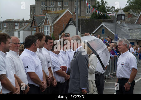 Padstow, Cornwall, UK. 20th July 2015. The Duke and Duchess of Cornwall starting their annual visit to the Duchy at Padstow. The Duke seen here with crew of the local Lifeboat. Credit:  Simon Maycock/Alamy Live News Stock Photo
