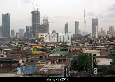 Mumbai Skyline with Slum houses & skyscrapers highrise buildings in the background Stock Photo
