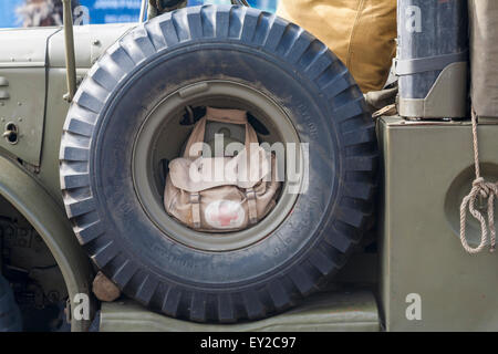 Detail of first aid bag inside tyre on military vehicle on display at Poole Vintage event in July Stock Photo