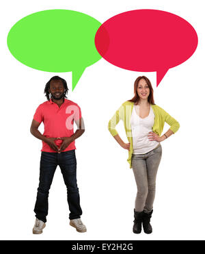 Smiling multicultural multi ethnic young people man and woman talking with speech bubble and copyspace Stock Photo