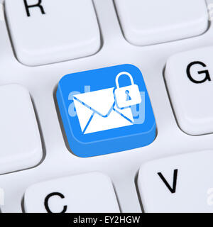 Computer concept sending encrypted E-Mail protection secure mail via internet on computer keyboard with letter symbol Stock Photo