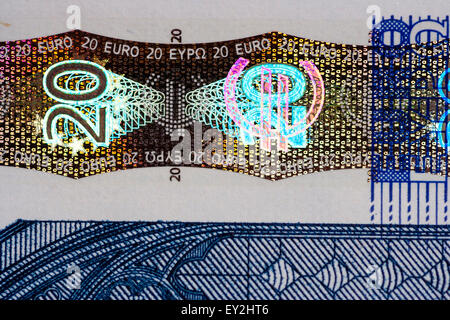 Close up of the hologram 20 symbol on a 20 Euro banknote, one of the security features to counter counterfeiting. Stock Photo