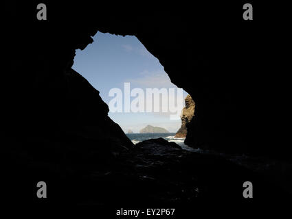 The island of Boreray and Stac Lee and Stac an Armin viewed through a sea cave on the northern end of Hirta. Hirta, St Kilda, Stock Photo