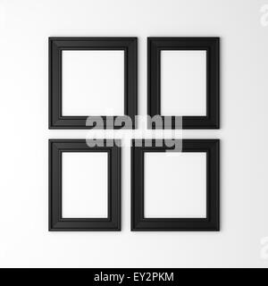 four blank black photo frames on white wall Stock Photo