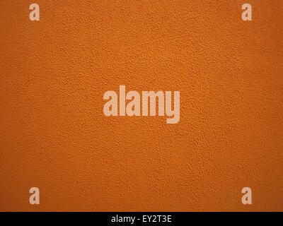 Fine texture on the stone wall of orange color from the folds of cement Stock Photo